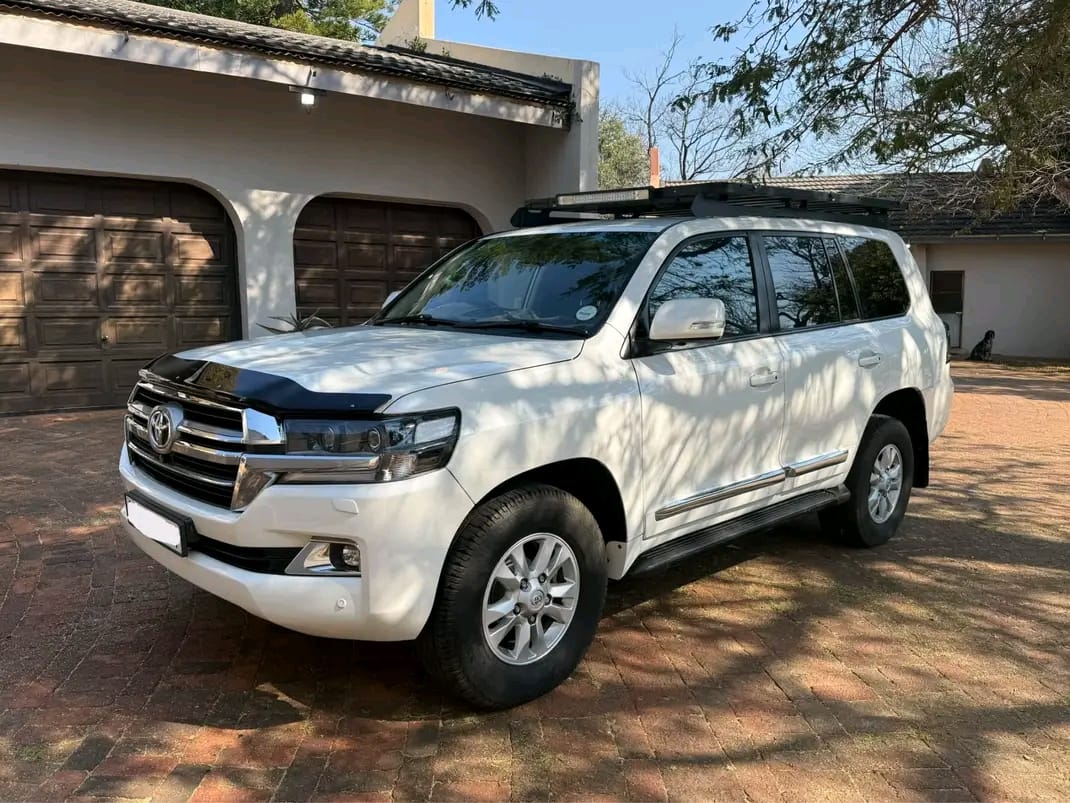 White Toyota Land Cruiser transfer vehicle